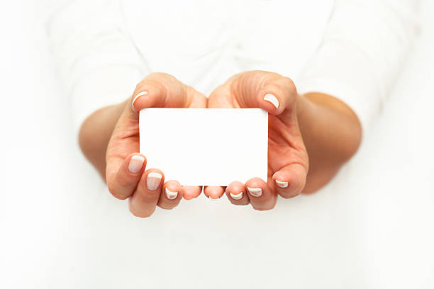 Woman's hands holding a card. stock photo