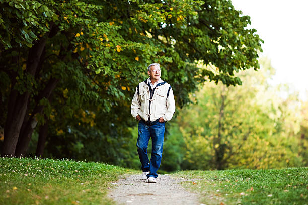 istock Senior man walking in park 533179955