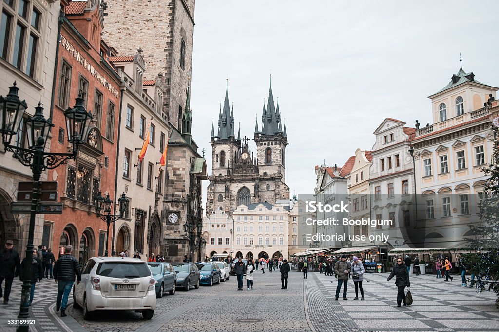 Old Town Square in Prague with tourists Prague, Czech republic - january 9, 2015: Group of people walking on Old Town Square in Prague on january 9, 2015. Christmas holiday continuing for tourists 2015 Stock Photo