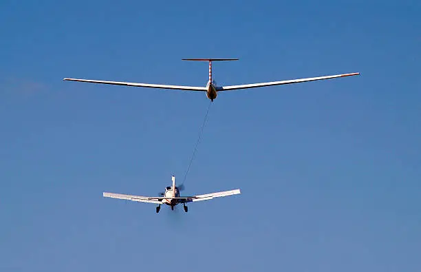 Photo of airplane towing a glider