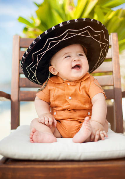 Baby wearing a mexican sombrero stock photo
