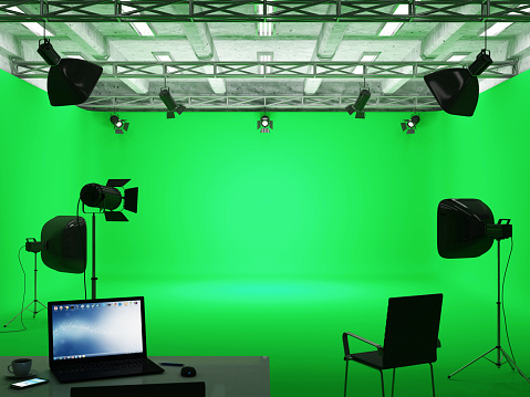 Pavilion Interior of Modern Film Studio with Green Screen and Light Equipment
