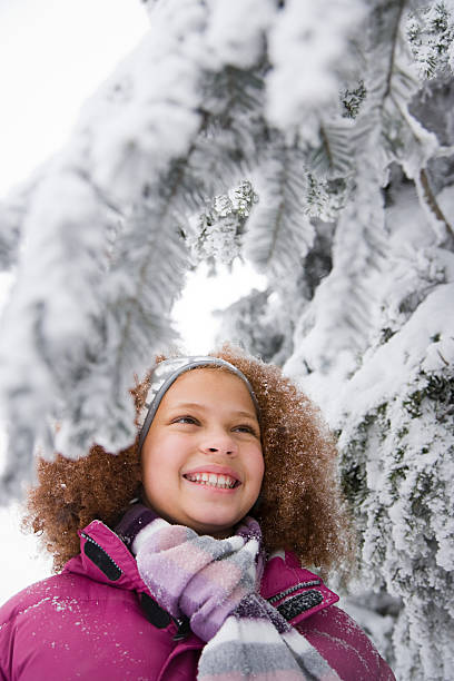 istock Girl and snowy branches 533192811
