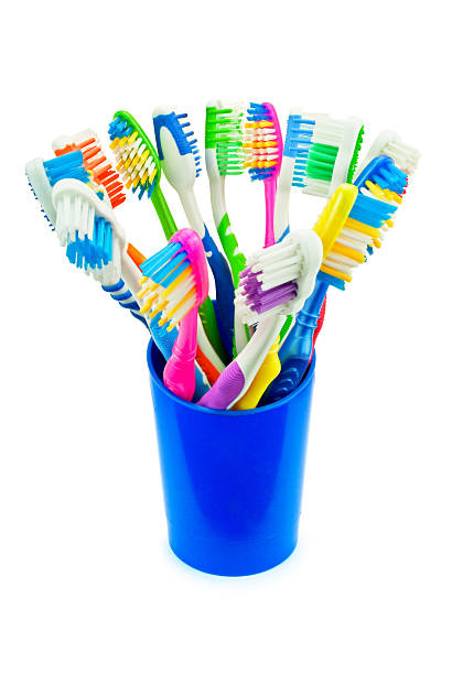 istock colorful toothbrushes in a blue cup 533193609