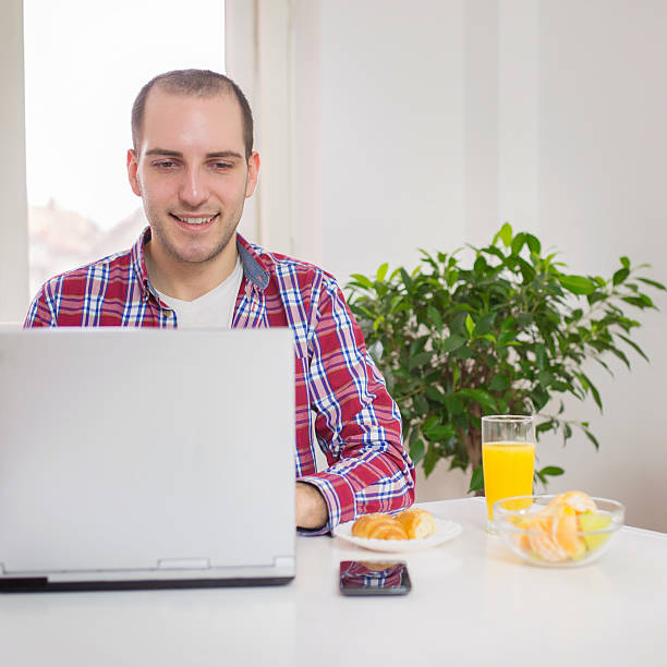 istock Young man working at home on the laptop 533194527