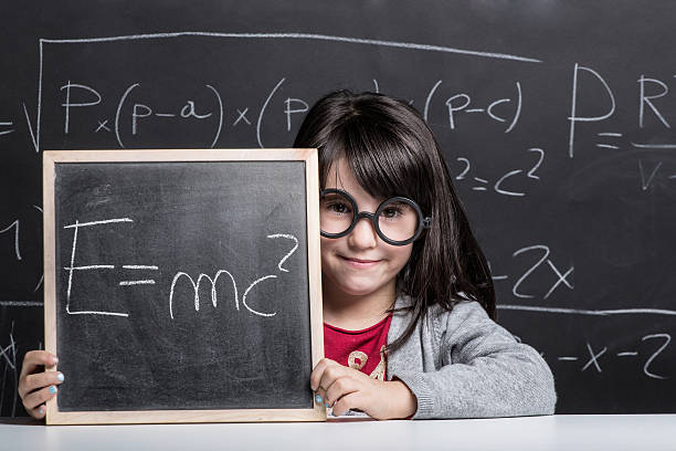 istock Little girl against blackboard. 533194725