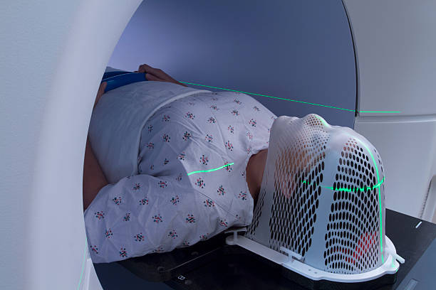 Woman Receiving a Medical Scan for Cancer Diagnosis stock photo
