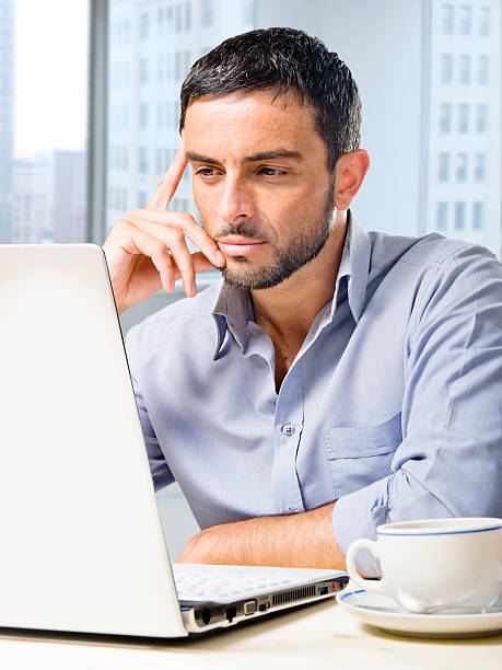 istock attractive businessman working on computer at office desk 533210419