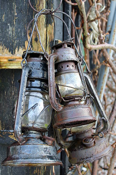 istock Three rusty old lanterns hanging on shed - parafin/oil 533213319