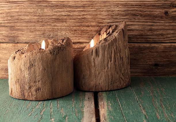 istock Two candles placed in very old wooden bars on board 533213365