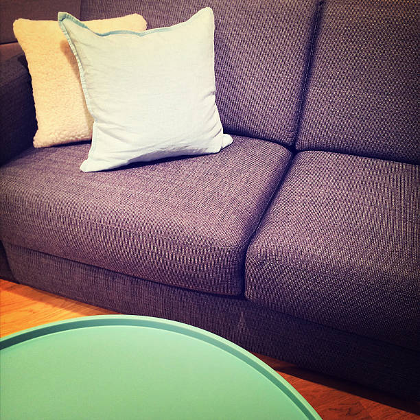 istock Green coffee table and sofa with cushions 533214205
