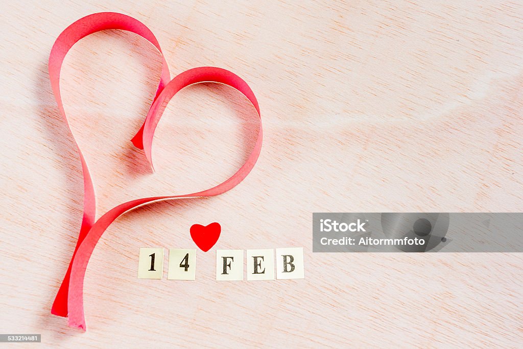 Valentine's day 14 Feb, Valentine's day on blonde wooden with a papper heart  background 2015 Stock Photo