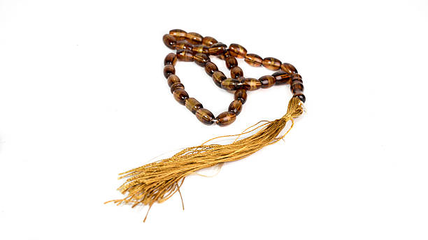 istock Tasbih, scripture, prayer beads or prayer beads on wooden Koran bookstand 533214831
