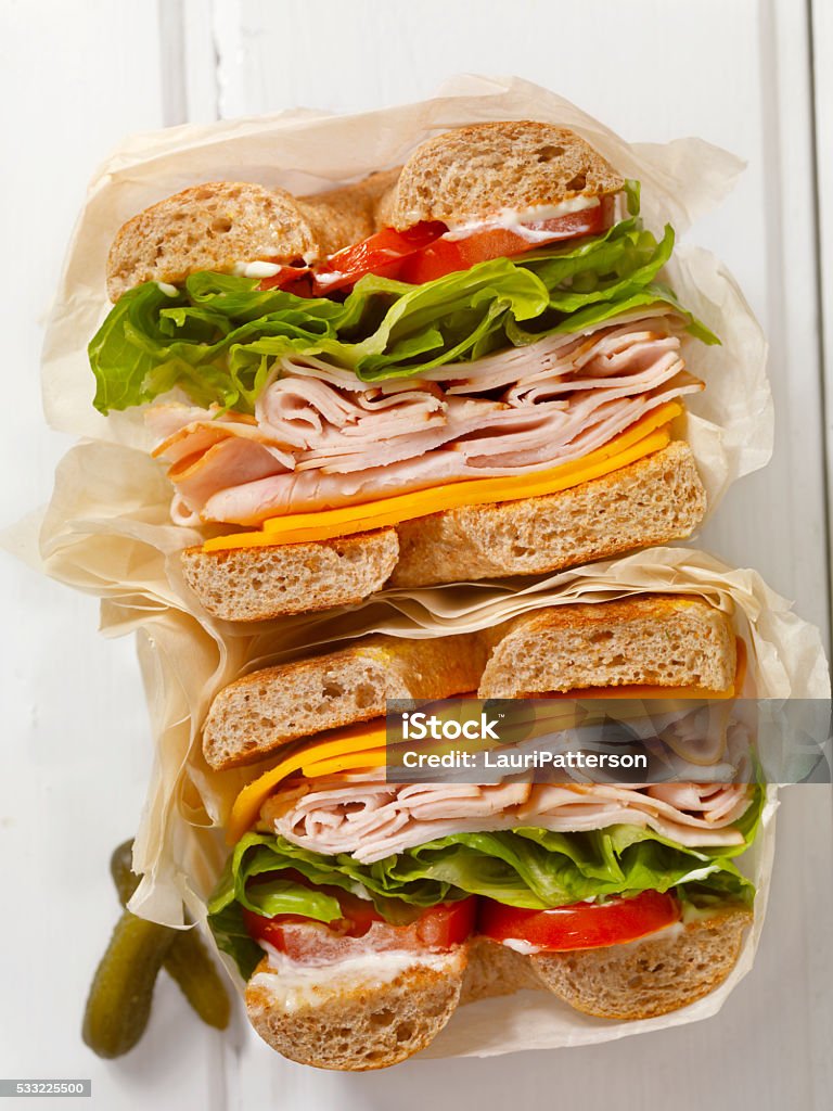 Deli Style Turkey Bagel Sandwich Deli Style Turkey Bagel Sandwich with Cheddar Cheese, Lettuce,Tomato and Mayo - Photographed on a Hasselblad H3D11-39 megapixel Camera System Sandwich Stock Photo