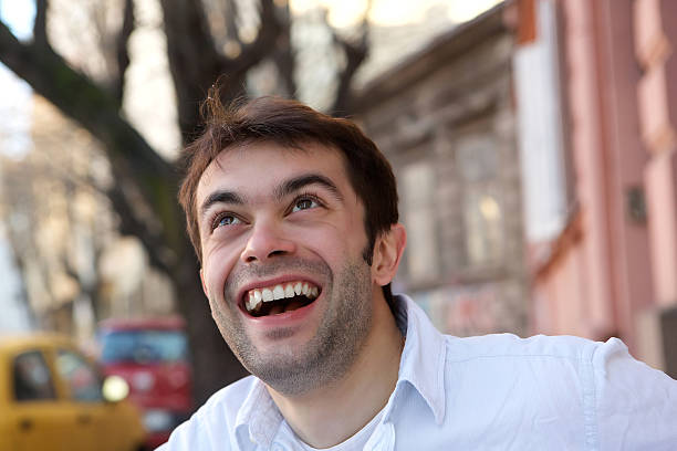 istock Handsome young man smiling outdoors 533227379