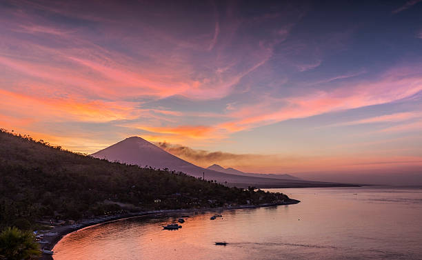 Coastline view of Amed village in Bali at dusk stock photo