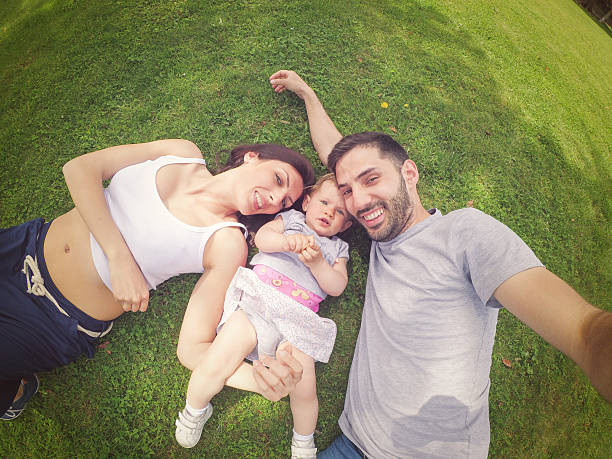 istock Taking selfie family on green grass 533227854