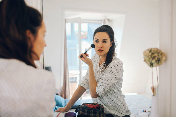 istock Young Parisian woman putting make up 533227918