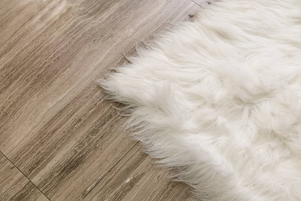 istock Corner of wool carpet on marble floor 533228411