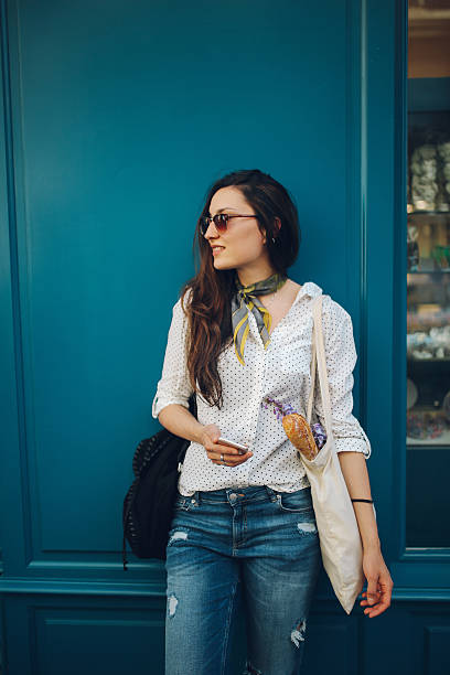 istock Young Parisian woman buying in bakery 533228576