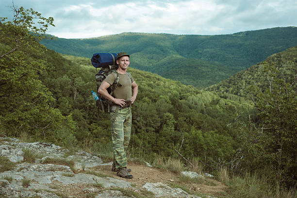 istock Young man hiking smiling happy portrait. 533229669