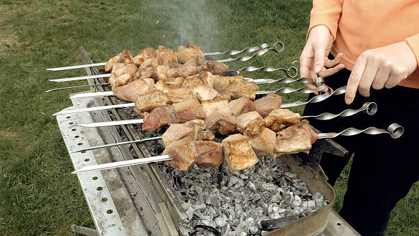 istock Barbeque skewers with meat cooking on brazier 533229718