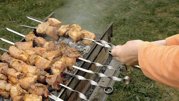 istock Barbeque skewers with meat cooking on brazier 533229744