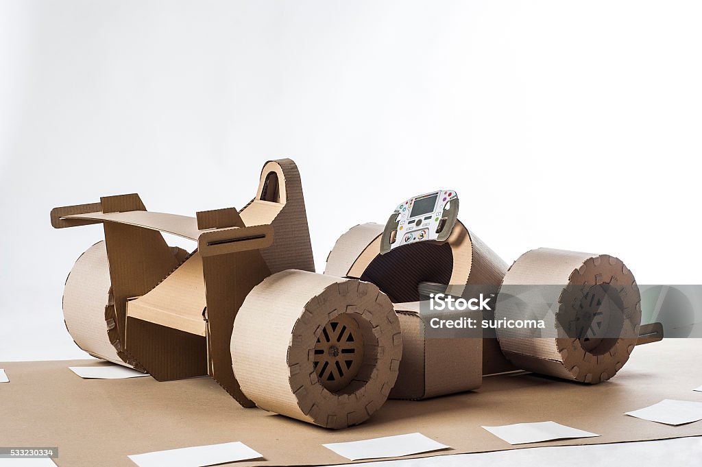 cardboard racing car Photo of cardboard racing car on white background Auto Racing Stock Photo