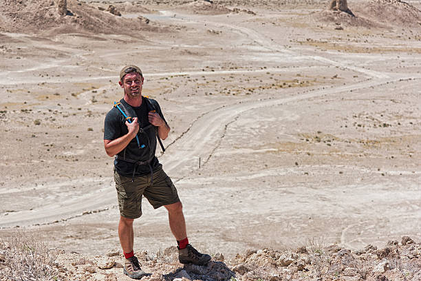 istock One Man Hiking Along a Desert Ridge 533230654