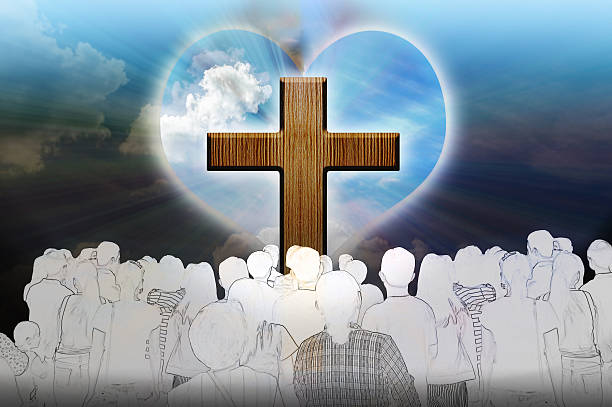 istock Crucifix and light with people on dark background 533231162