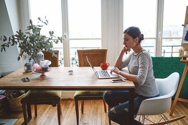 istock Young freelancer woman working in her Parisian apartment 533232090