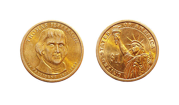 istock Golden one dollar coin isolated on white 533232559