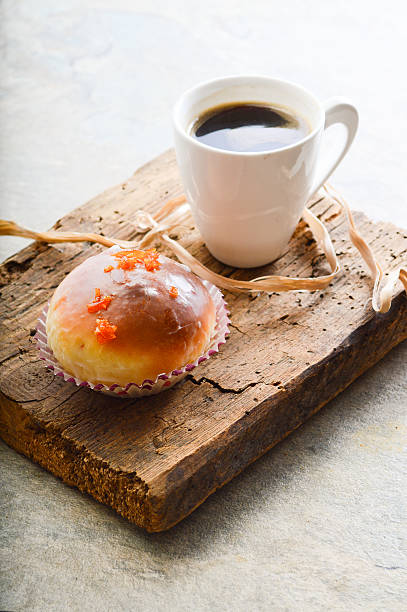 istock donuts and coffee on wooden background 533233001