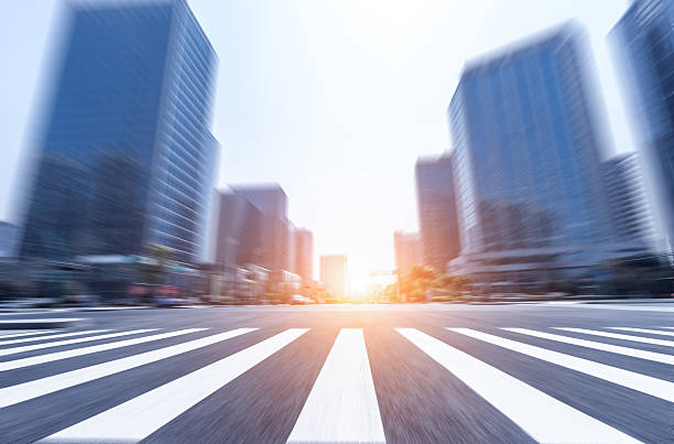 istock traffic on road intersection near modern office buildings at sun 533234064