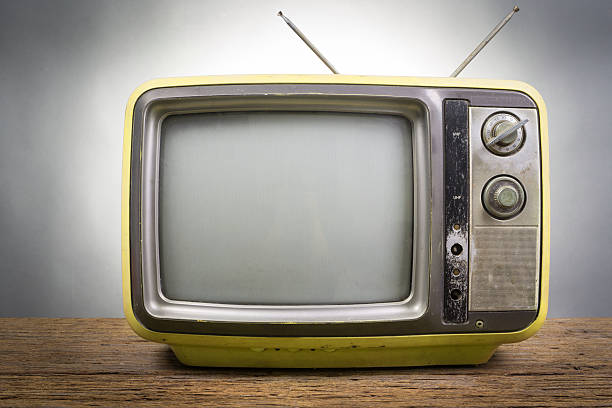 Vintage Television on wood table Vintage Television on wood table on gray background old television stock pictures, royalty-free photos & images