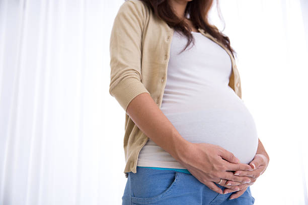 istock Pregnant woman touching her belly 533234624