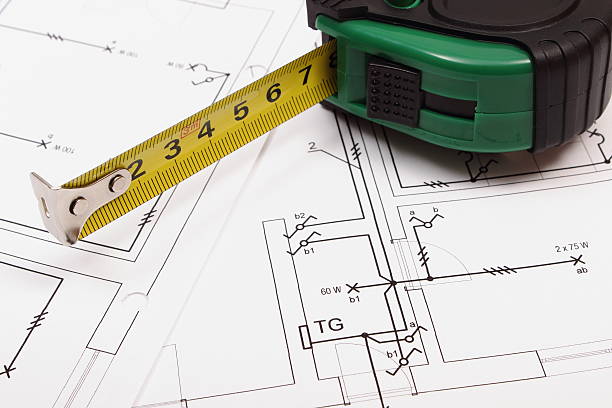 metro a nastro sulla costruzione di casa disegno elettriche - house construction tape measure blueprint foto e immagini stock