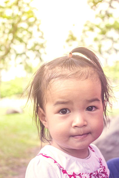 istock girl in a garden. 533238412