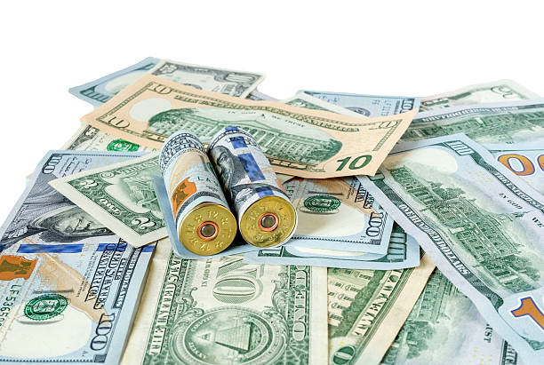 istock Bullets on dollar bills terrorism, war, Ukraine, armed conflict 533239384