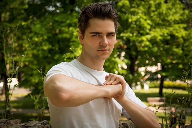 istock Attractive confident young man in nature environment 533240539