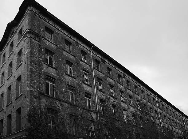 istock dilapidated industrial building with bricks and broken windows 533240548