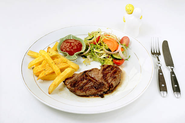 istock Beefsteak served with fries and salad 533240831