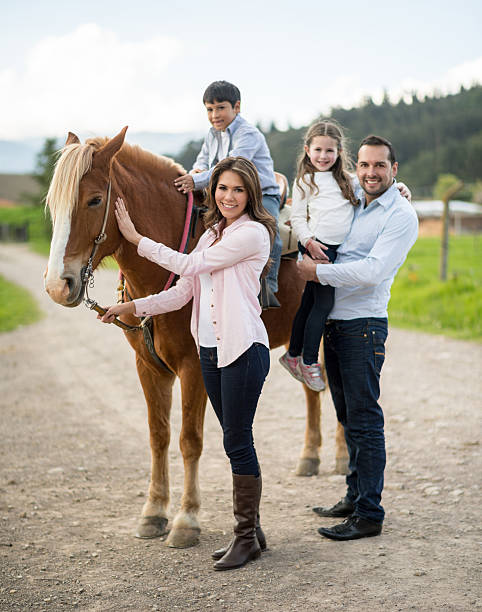 istock Family riding a horse 533240901