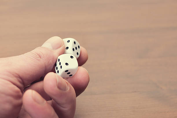 istock Hand holding pair of Dice 533242157