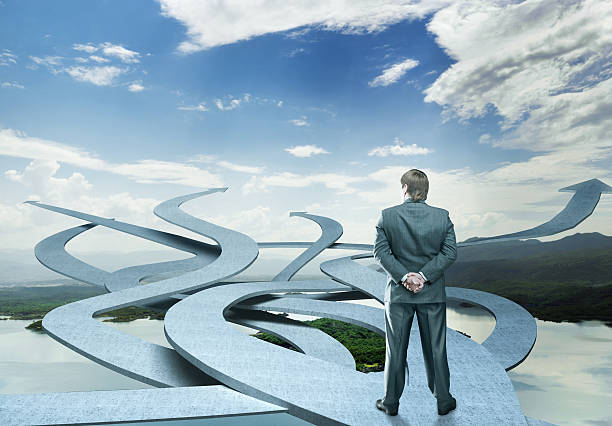istock Businessman stands choosing his way 533242303