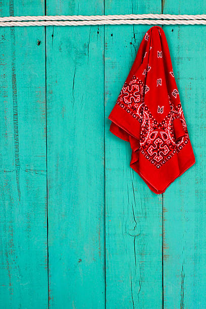 istock Red bandana hanging on rope on wood background 533242495