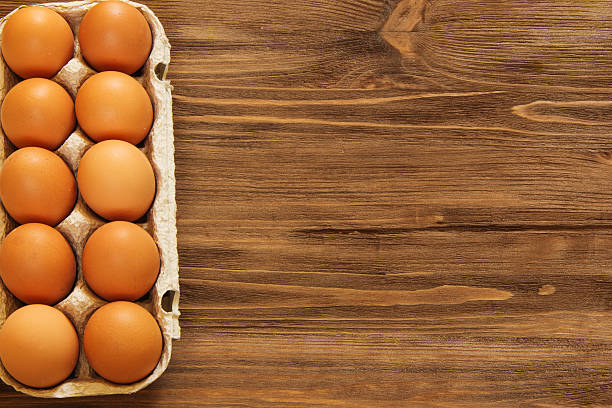 istock eggs in a tray on a wooden background 533243554