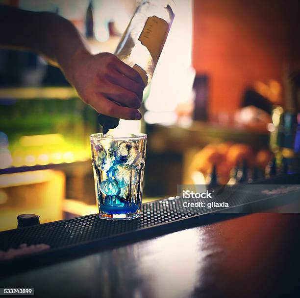 Bartender Pouring Drink Stock Photo - Download Image Now - 2015, Adult, Alcohol - Drink