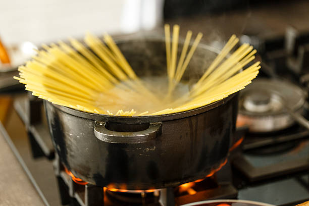 istock Raw pasta in saucepan on stove 533245020