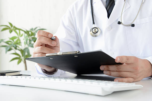 istock Doctor checking medical record 533246078